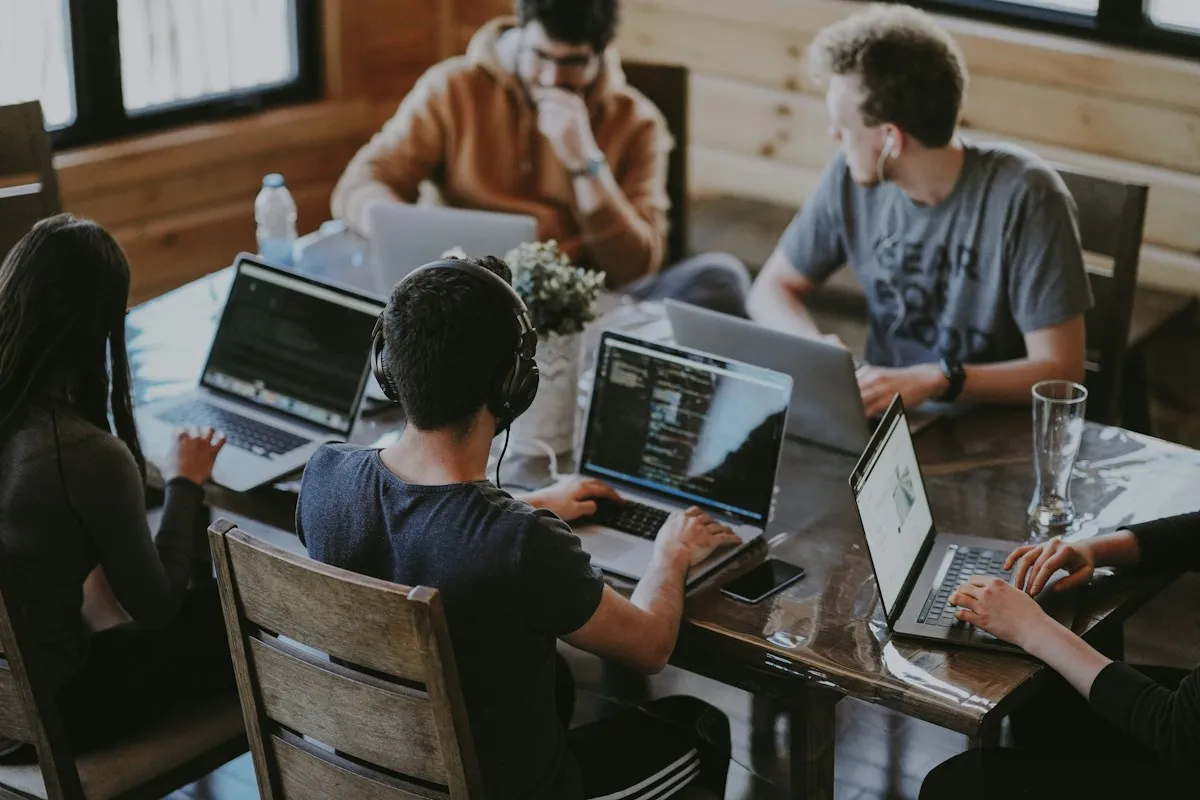 Professionals discussing business plans around a meeting table